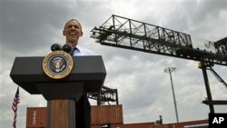 President Barack Obama speaks at the Port of Tampa about trade with Latin America before heading to Colombia for the Summit of the Americas, in Tampa, Florida, April 13, 2012.
