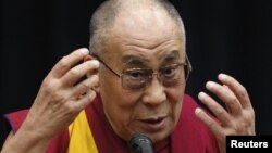 FILE - Tibetan spiritual leader the Dalai Lama speaks before members of the Japanese parliament, at the upper house members' office building in Tokyo, Nov. 13, 2012.