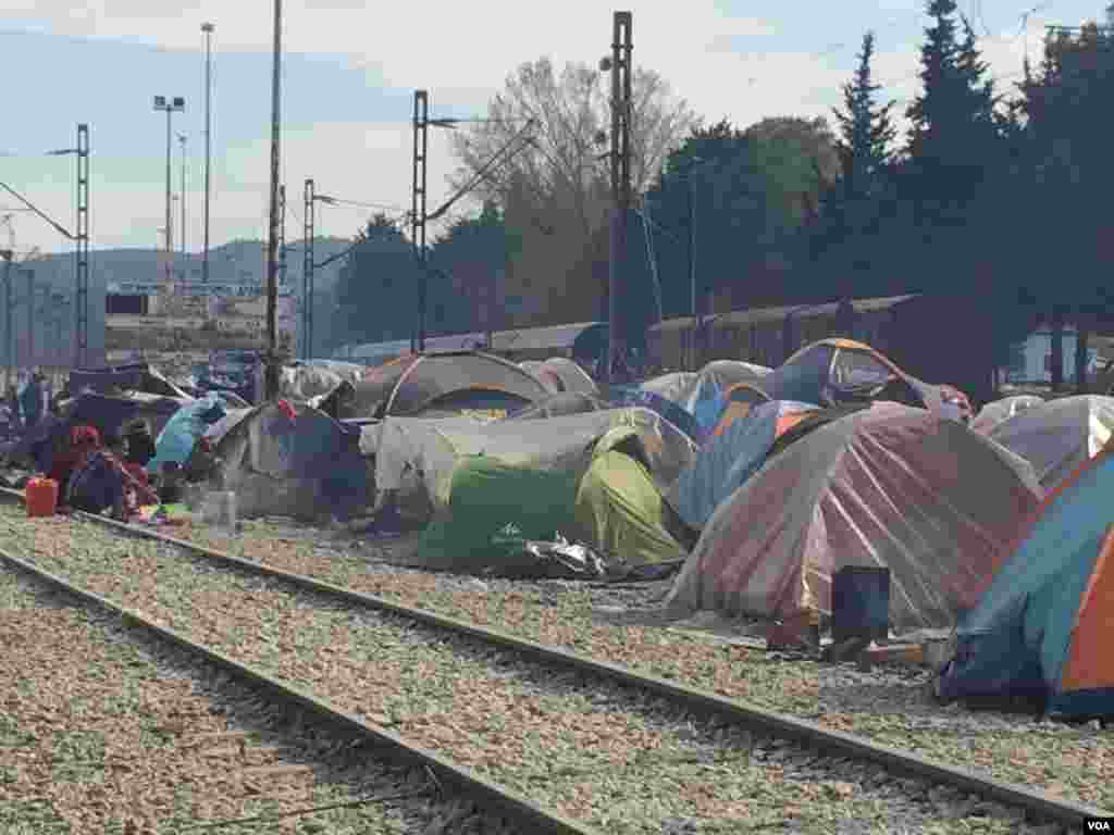 Besides staging sit-ins on train tracks, refugees set up tents to prevent trains from moving, in Idomeni, Greece, March 30, 2016. With no money or any political influence, refugees say it&rsquo;s the only leverage they have. (Photo - H. Murdock/VOA)