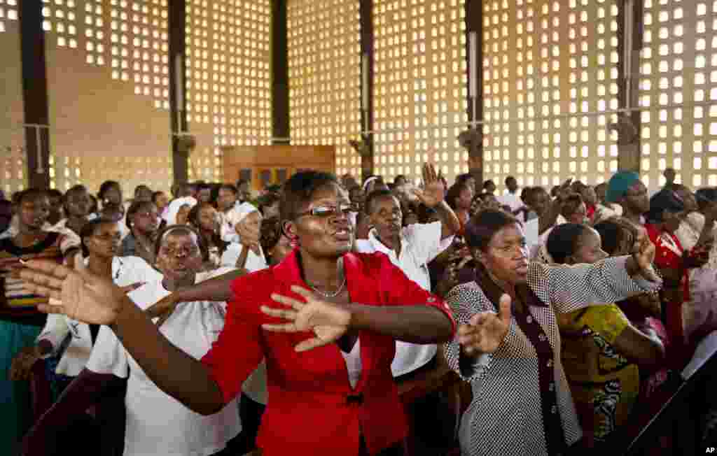 Christians sing during the service at the Our Lady of Consolation Church, which was attacked with grenades by militants almost three years ago, in Garissa, Kenya, April 5, 2015. Easter Sunday&#39;s ceremony was laden with emotion for the several hundred members of Garissa&#39;s Christian minority, which is fearful following the recent attack on Garissa University College by al-Shabab, a Somalia-based Islamic extremist group.