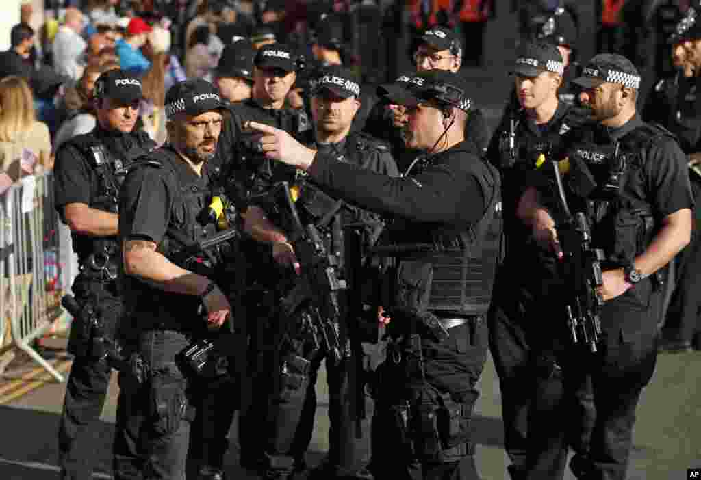Armed police officers patrol ahead of the wedding ceremony of Prince Harry and Meghan Markle at St. George's Chapel in Windsor Castle in Windsor, near London, May 19, 2018.