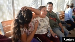 Central American migrants are pictured as they wait to enter the U.S., asking for refuge and to be reunited with their children, after being separated from them by immigration authorities when crossing into the United States illegally last year, Mexico, M
