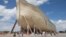 Visitors pass outside the front of a replica Noah's Ark at the Ark Encounter theme park in Williamstown, Kentucky, July 5, 2016. 