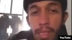 Abu Jandal, an Indonesian leader for the Islamic State, appears in a video posted on YouTube in 2014.