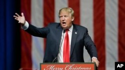 Republican presidential candidate, businessman Donald Trump addresses supporters at a campaign rally, Dec. 21, 2015, in Grand Rapids, Mich. 
