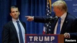 Sarang, a helicopter display team of Indian Air Force, performs aerobatic maneuvers on the inaugural day of Aero India 2021 at Yelahanka air base in Bengaluru.