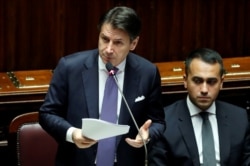 FILE - Italian Prime Minister Giuseppe Conte presents his government's program as 5-Star Movement leader Luigi di Maio sits next to him, ahead of confidence vote at the Parliament in Rome, Sept. 9, 2019.
