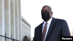 Newly confirmed U.S. Defense Secretary Lloyd Austin arrives to begin his first day in office at the Pentagon in Arlington, Virginia, U.S., January 22, 2021. REUTERS/Tom Brenner