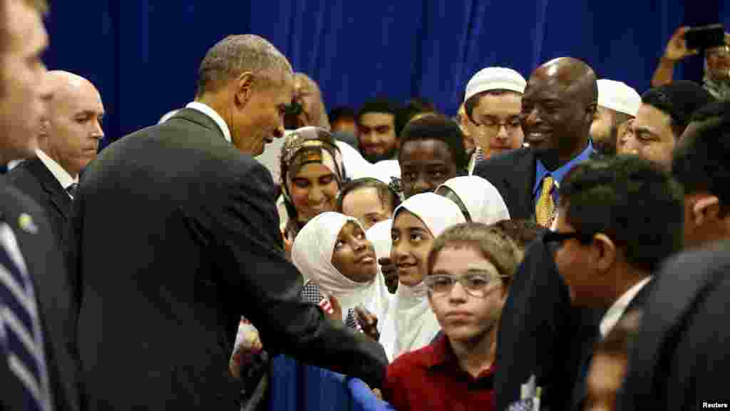 U.S. President Barack Obama greets students after his remarks at the Islamic Society of Baltimore mosque in Catonsville, Maryland, Feb. 3, 2016.
