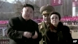 In this Feb. 16, 2013 image made from video, North Korean leader Kim Jong Un, left, along with his aunt Kim Kyong Hui, right, attends a statue unveiling ceremony in Pyongyang, North Korea on the anniversary of late North Korean leader Kim Jong Il's…