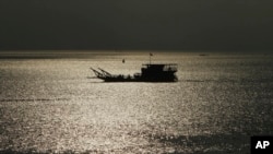 A ferry transports people from Phnom Penh to Arey Ksat across the Mekong River outside Phnom Penh, Cambodia, Jan. 28, 2020.