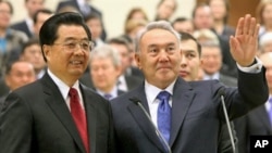 Kazakh President Nursultan Nazarbayev (R) with Chinese President Hu Jintao (L) at a pipeline opening ceremony in Astana, 2009. President Hu Jintao's visit highlighted Beijing's growing influence over Central Asia's strategic energy resources.