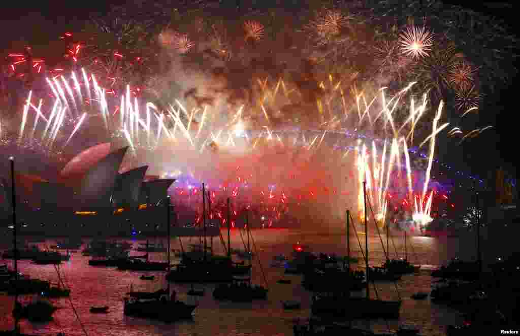 Fireworks light up the Sydney Harbour Bridge and Sydney Opera House during New Year&#39;s celebrations on Sydney Harbour, Australia, Jan. 1, 2018.