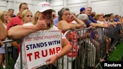Campaign supporters listen to Republican U.S. presidential candidate Donald Trump address during a campaign stop at the Grand Park Events Center in Westfield, Indiana, July 12, 2016.