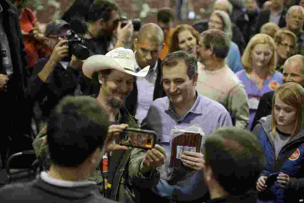 Republican presidential candidate, Sen. Ted Cruz, R-Texas, talks to supporters after a campaign event at Iowa State Fairgrounds in Des Moines, Iowa, Feb. 1, 2016.