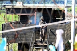 A South Korean army soldier comes out from their military guard post in Paju, South Korea, near the border with North Korea, Friday, June 19, 2020.