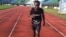 Idrissa Kargbo gets ready to run at the National Stadium, Freetown, Sierra Leone, Oct. 21, 2013 (N.deVries for VOA).