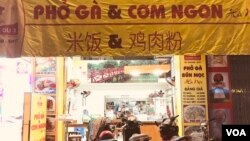 Many Vietnamese shops carry signs in Chinese, a lingering sign of the shared history, though Vietnam and China have taken different turns in the modern economy. (H. Nguyen/VOA)