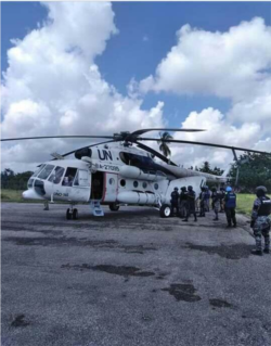 Arnel Joseph dressed and on a stretcher. UN helicopter prepares to transfer him to Port au Prince.