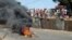 Anti-government protesters set fire during clashes with Guinea security forces in Conakry, Feb. 27, 2013.