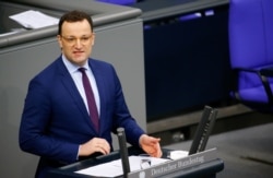 German Health Minister Jens Spahn speaks at the lower house of parliament Bundestag on the start of the coronavirus vaccinations, in Berlin, Germany, Jan. 13, 2021.