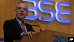 FILE - William C. Dudley, President and Chief Executive Officer of the Federal Reserve Bank of New York addresses Indian businessmen at the Bombay Stock Exchange (BSE) Mumbai, India, May 11, 2017.