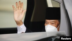 Malaysian Prime Minister Muhyiddin Yassin arrives at the National Palace for a meeting with the king, in Kuala Lumpur, Malaysia, Aug. 16, 2021.