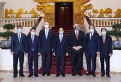 U.S. Secretary of State Mike Pompeo poses for a photo with Vietnam's Prime Minister Nguyen Xuan Phuc after their meeting at the Government Office in Hanoi, Vietnam, Oct. 30, 2020.