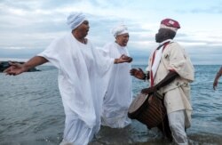 Members of the Africa Queen Mothers participate in a sunrise service and spiritual cleansing ceremony in remembrance of the 400-year anniversary of the arrival of the first enslaved Africans in Virginia, in Hampton, Va., Aug. 24, 2019.
