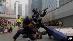 Police detain protesters during the demonstration in Hong Kong, Sept. 29, 2019. 