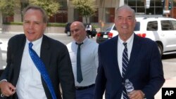Expelled Arizona House Rep. Don Shooter, right, arrives at court with attorney Tim Nelson, left, June 14, 2018, in Phoenix. 