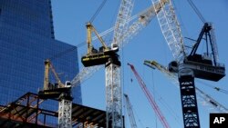 Cranes work at Hudson Yards construction site in New York, Nov. 23, 2015.
