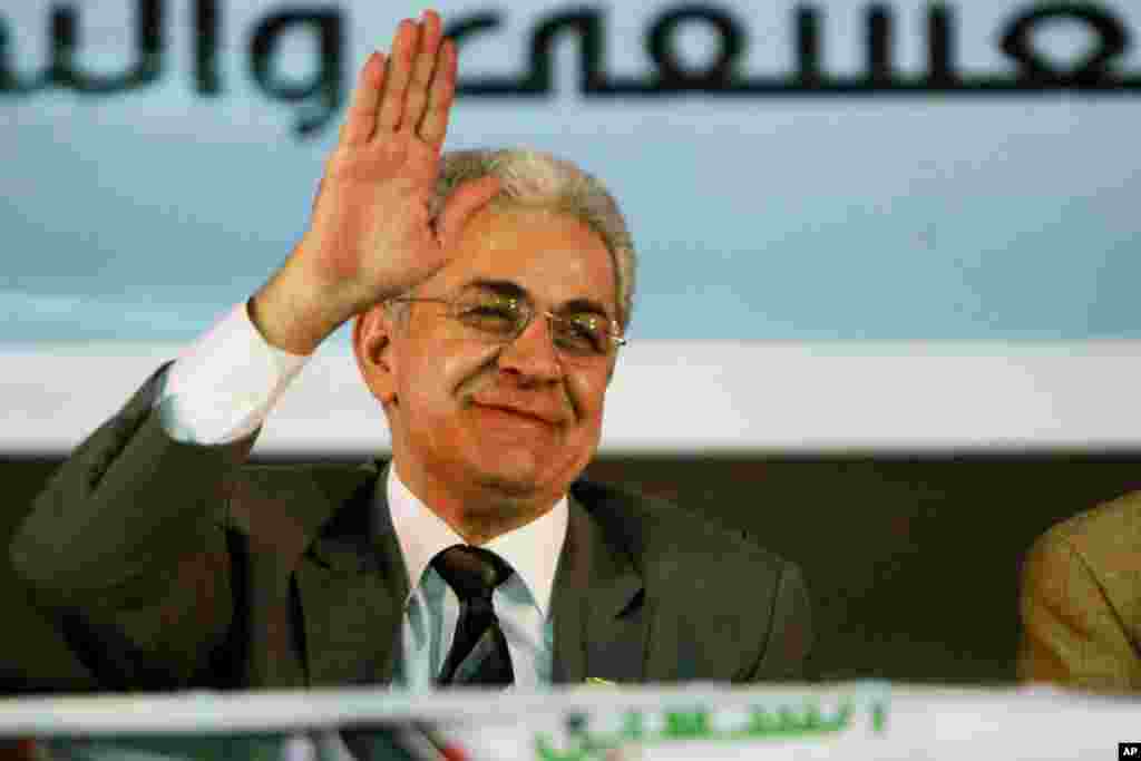 Egyptian presidential candidate Hamdeen Sabahi waves at his supporters during his campaign. He is the only opponent running against former army chief Abdel-Fattah el-Sissi, in Mahalla, 125 kilometers north of Cairo, May 5, 2014.
