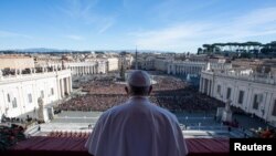 Pope Francis delivers the "Urbi et Orbi" message from the main balcony of Saint Peter's Basilica at the Vatican, Dec. 25, 2018. 