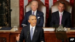 Vice President Joe Biden and House Speaker of Ohio listen as President Barack Obama gives his State of the Union address before a joint session of Congress on Capitol Hill in Washington, Jan. 20, 2015.