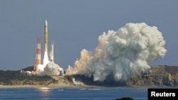 An H3 rocket carrying a land observation satellite lifts off from the launching pad at Tanegashima Space Center on the southwestern island of Tanegashima