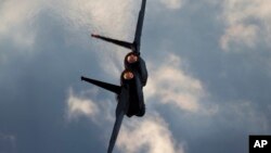 FILE - An Israeli Air Force F-15 plane is seen in flight at the Hatzerim air force base near the city of Beersheba, Israel, Dec. 29, 2016. 