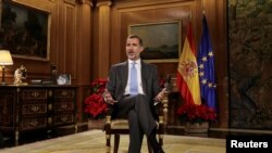 Spain's King Felipe VI delivers his traditional Christmas address at Zarzuela Palace in Madrid, Spain, December 23, 2017 in this photo released December 24, 2017. 