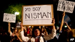 Demonstrator holds sign that says 'I am Nisman' in Spanish during protest outside the government house, Plaza de Mayo, Buenos Aires, Argentina, Jan. 19, 2015.