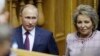 FILE - Russian President Vladimir Putin and Federation Council Speaker Valentina Matviyenko attend the Eurasian Women's Forum in St. Petersburg, Russia, Sept. 20, 2018. A report that Matviyenko would be leaving her post led to the journalists' firing. 