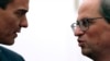 Spain's Prime Minister Pedro Sanchez (L), and the president of the country's Catalonia region, Quim Torra talk during a meeting in Barcelona, Spain, Dec. 20, 2018. 