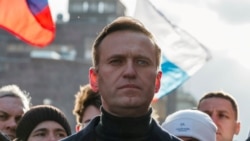 FILE - Russian opposition politician Alexei Navalny takes part in a rally in Moscow, Russia, Feb. 29, 2020.
