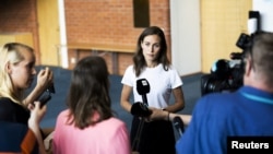 Finland's Prime Minister Sanna Marin speaks with members of the media in Kuopio