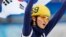 Shim Suk-hee of winner South Korea's skating team celebrates and holds up her national flag after the women's 3,000 meters short track speed skating relay final event at the Sochi 2014 Winter Olympic Games on February 18, 2014. 