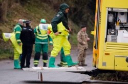 FILE - Military forces work on a van in Winterslow, England, March 12, 2018, as investigations continue into the nerve agent poisoning of Russian ex-spy Sergei Skripal and his daughter, Yulia, in Salisbury, England, on March 4, 2018.
