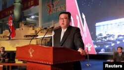 FILE - North Korean leader Kim Jong Un speaks at the Defense Development Exhibition, in Pyongyang, North Korea, in this undated photo released Oct. 12, 2021, by North Korea's Korean Central News Agency.
