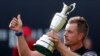 Henrik Stenson of Sweden holds up the trophy to the crowd after winning the British Open Golf Championships at the Royal Troon Golf Club in Troon, Scotland, July 17, 2016.