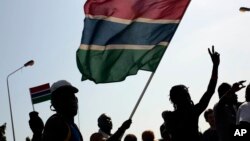 Gambians celebrate the victory of opposition coalition candidate Adama Barrow against longtime President Yahya Jammeh in the streets of Serrekunda, Gambia, Dec. 2, 2016.