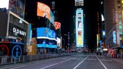 Seventh Avenue is mostly empty during what would normally be a Times Square packed with people, Dec. 31, 2020, in New York, as celebrations were truncated this New Year's Eve because of the ongoing pandemic.