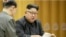FILE - This image made from undated video of a news bulletin aired by North Korea's KRT on Sept. 3, 2017, North Korea's leader Kim Jong Un holds the Presidium of the Political Bureau of the Central Committee. 